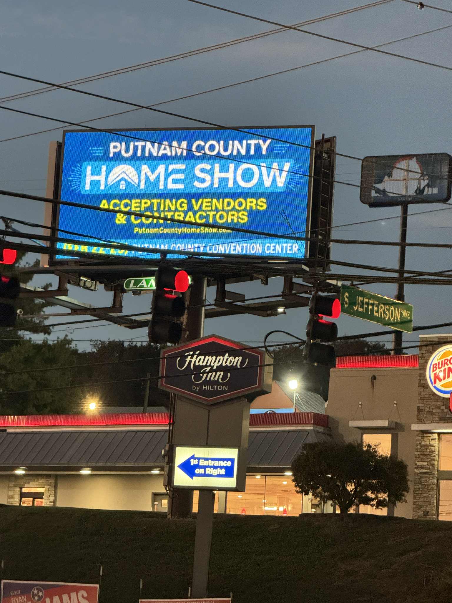 A Putnam County Home Show billboard illuminated at night