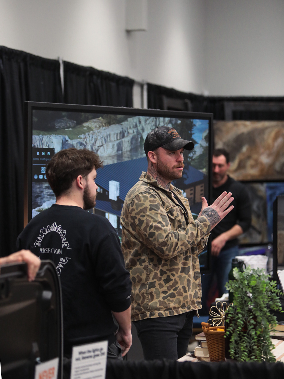 An exhibitor in conversation at a regional home show